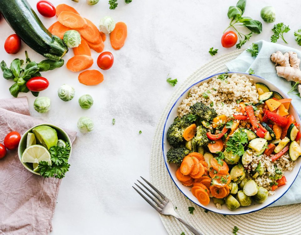 Colorful quinoa salad with fresh vegetables creates a healthy, balanced meal.