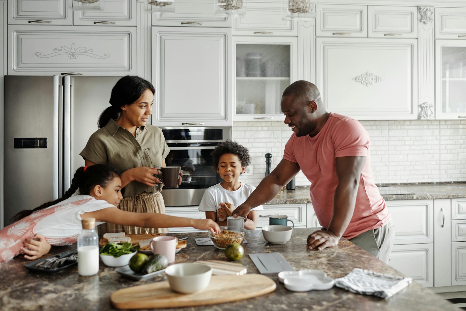 A happy family having breakfast together in their stylish kitchen, fostering love and togetherness.