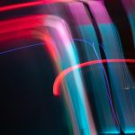 Dynamic and colorful long exposure light streaks in an abstract artistic composition.